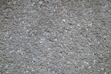 Gray plastered wall with cracks