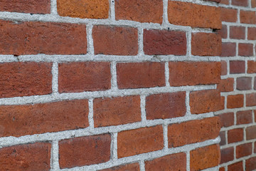corner of a brick wall on the background of another wall