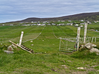 County Donegal, Ireland - Green pasture with fence and gate