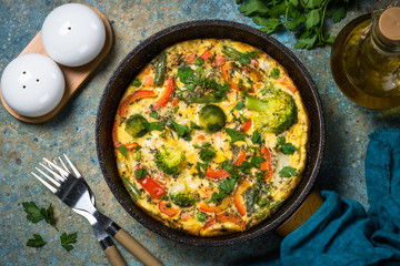 Frittata with fresh vegetables in the skillet.