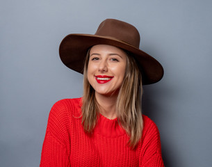  young woman in red sweater and hat