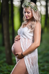 Fototapeta na wymiar Young pregnant woman outdoor