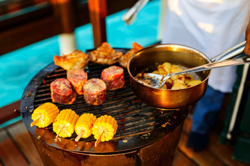 Grilled meat and corn
