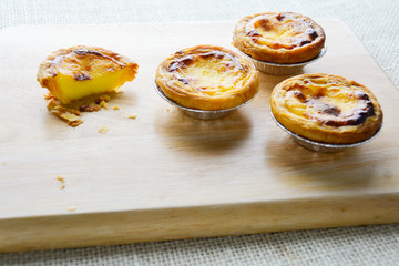 Portuguese Egg Tarts, is a kind of custard tart found in various Asian countries. The dish consists of an outer pastry crust and is filled with egg custard and baked.