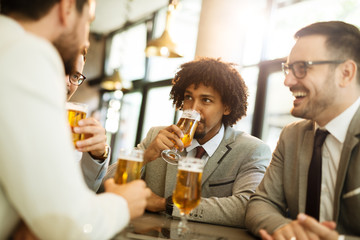 young businessmen after work in a pub