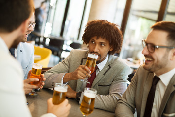 young businessmen after work in a pub
