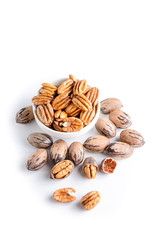 Organic pecan nuts on a white background