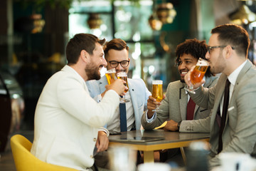 young businessmen after work in a pub