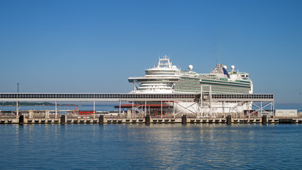 Naklejka premium Huge white cruise ship moored in the port.