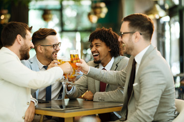 young businessmen after work in a pub
