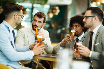young businessmen after work in a pub