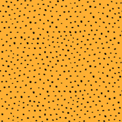 Abstract seamless pattern with black dots on orange background 