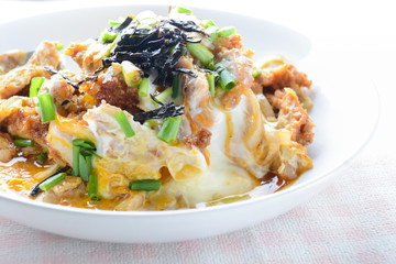 Japanese traditional food, Tonkatsu deep-fried pork cutlet on top with eggs
