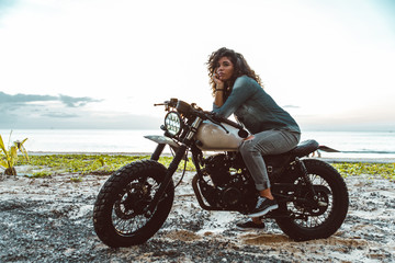 Fototapeta na wymiar Beautiful woman making a tour with her motorcycle