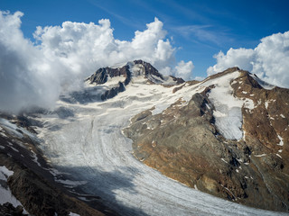 Mountain top view of Glacier Senales partly covered in clouds