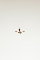 Airplane flying in the sky at sunset. Travel, vacation and holiday concept. Vintage and retro tones filter.