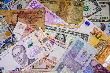 Multi currency background. Euro, american dollars, ukrainian hryvnias, egyptian pounds, russian roubles