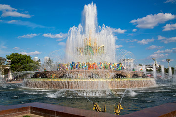 Stone flower fountain at Exhibition of achievements of the national economy (VDNH) in the contra light on a Sunny day. Moscow attractions of World tourism.