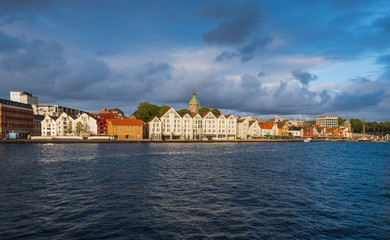 Fototapeta premium Stavanger, Norway - July 2019: The harbour in Stavanger city. This area is called Vågen. Evening with the rainbow