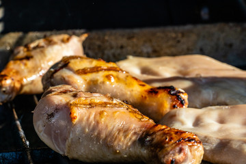 Chicken legs and breasts on the grill. Calgary, Alberta, Canada