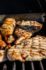Chicken legs and breasts on the grill. Calgary, Alberta, Canada