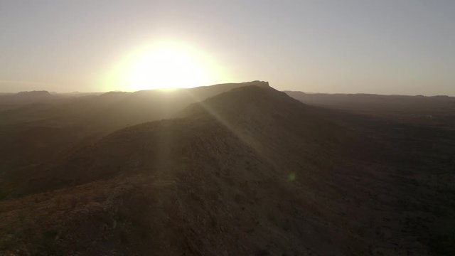 Aerial: Sun Rising Over Mountains In The Desert - Darwin, Australia