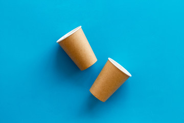 paper cups for coffee to take away on blue background space for text