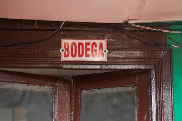 Sign Bodega over door, Spanish word meaning warehouse of strorage room