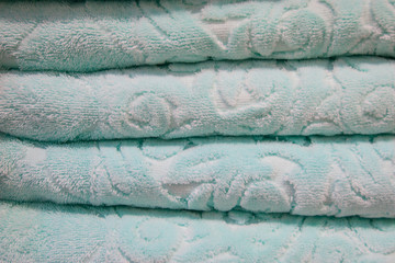 Score. Shelves with towels. Bath accessories. Terry towels are beautiful neat stacks. Colour. Life style.