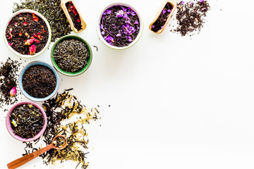 Dry leaves of herbal tea frame on white background top view mockup