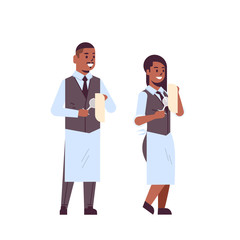 professional waiters couple polishing wine glasses with towel african american man woman restaurant workers in uniform flat full length white background