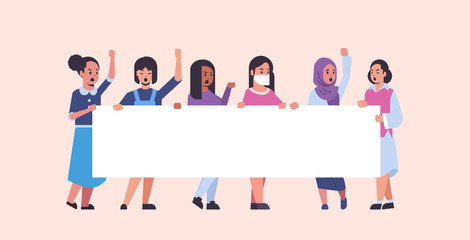 Fototapeta premium women protesters holding blank placard mix race girls activists with empty sign banner protest demonstration strike concept flat full length horizontal