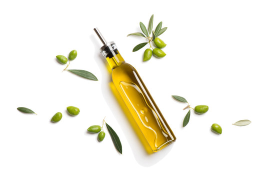 Olive oil in bottle and fresh olives. Above view.