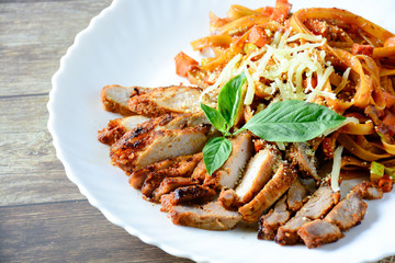Steak meat with spaghetti and cheese on wood background.