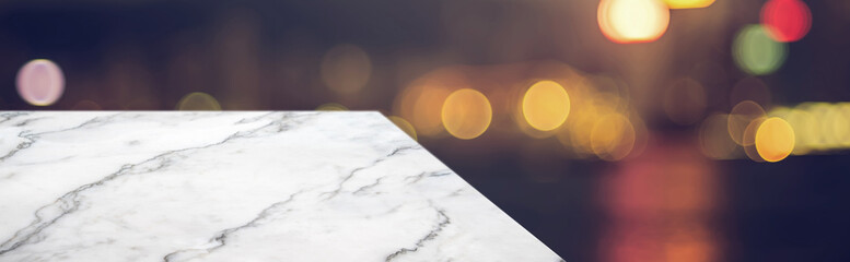 marble table top product display background with blur night cityscape.left perspective stone patio...