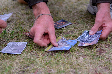 people play a game with cards on the grass in the garden