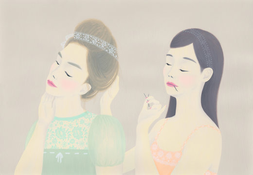 Woman styling hair of her friend