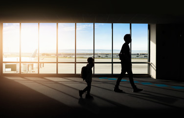 Fototapeta na wymiar Window with silhouette people at Airport.
