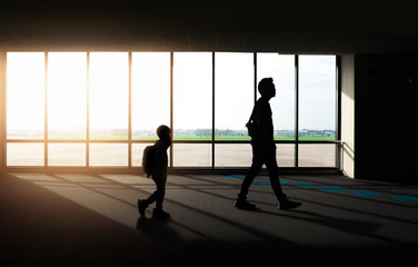 Fototapeta na wymiar Window with silhouette people at Airport.