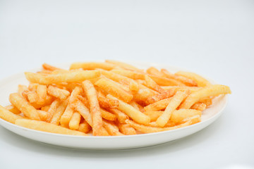 French fries on white dish and white background.