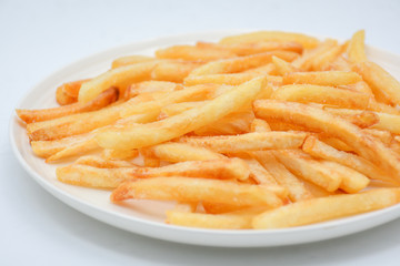 French fries on white dish and white background.