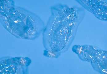 Plastic bottles isolated on blue background. Recycle waste management concept. Plastic Pet Bottles.