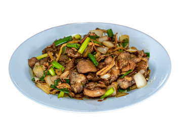 Traditional Chinese dish, the fried pork with herbals, served on dish close up, isolated on white background.