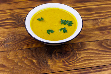 Pumpkin soup on a wooden table