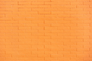 Obraz premium Texture background of orange brick wall. Vintage brick wall background painted in bright orange color. Vintage brick wall for background and texture.