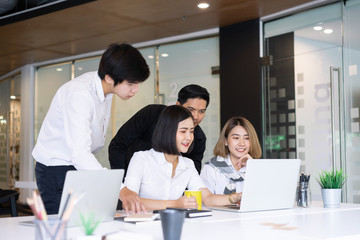 Diverse startup young business people group working together on laptop at modern office.
