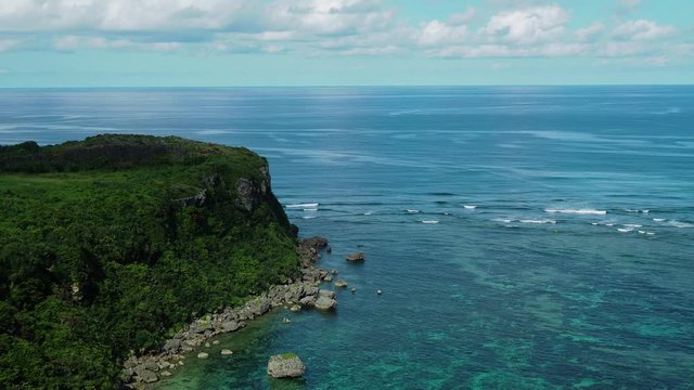 4K footage , Happy cliff or Kafu Banta with wave background , Okinawa island , Japan.