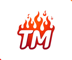 Uppercase initial logo letter TM with blazing flame silhouette,  simple and retro style logotype for adventure and sport activity.