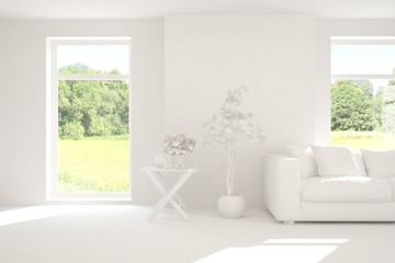Mock up of stylish room in white color with sofa and green landscape in window. Scandinavian interior design. 3D illustration