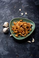 Garlic Fry or Tala Hua Lahsun in hindi, is a popular side dish or snacks from maharashtra, India